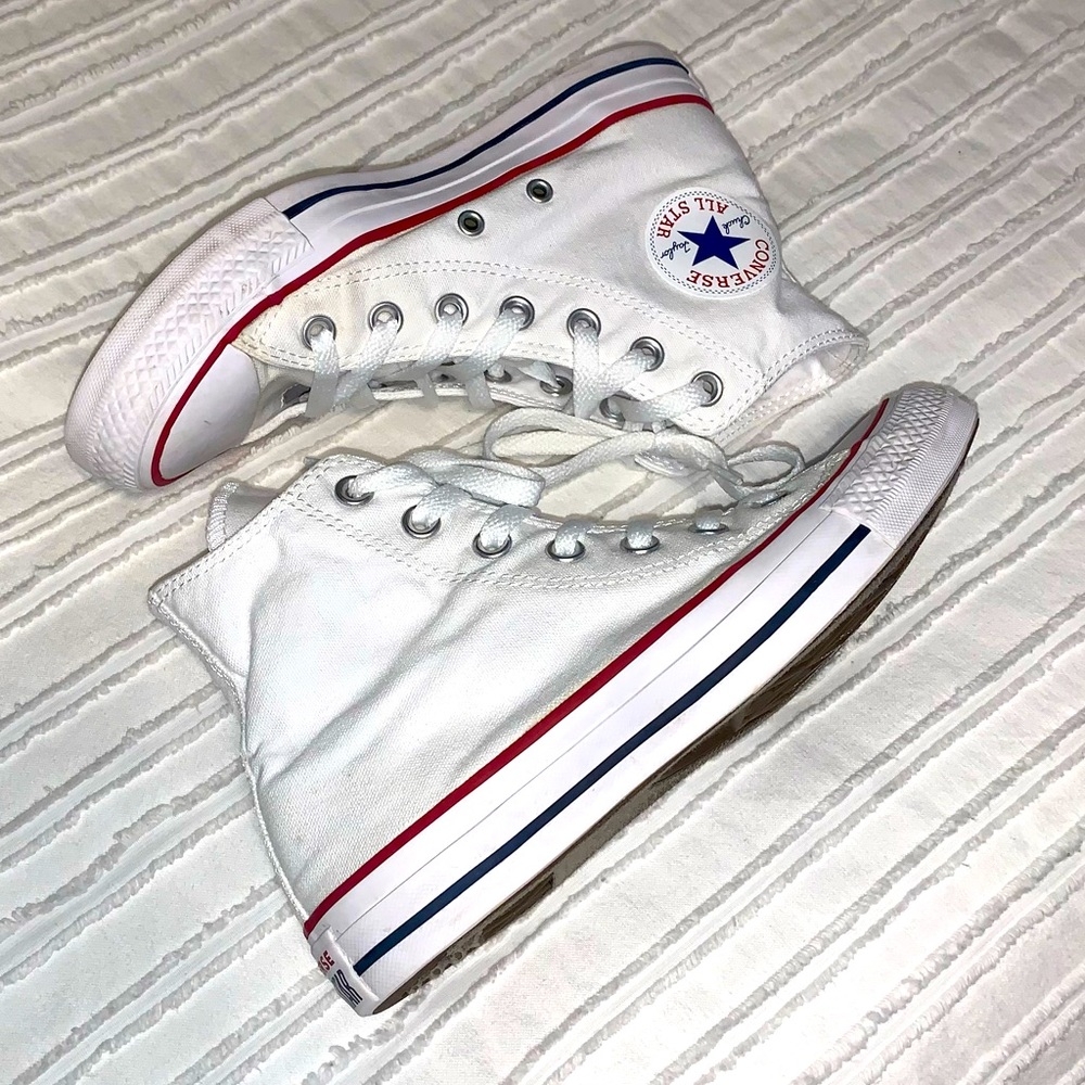 Nearly new white high top converse